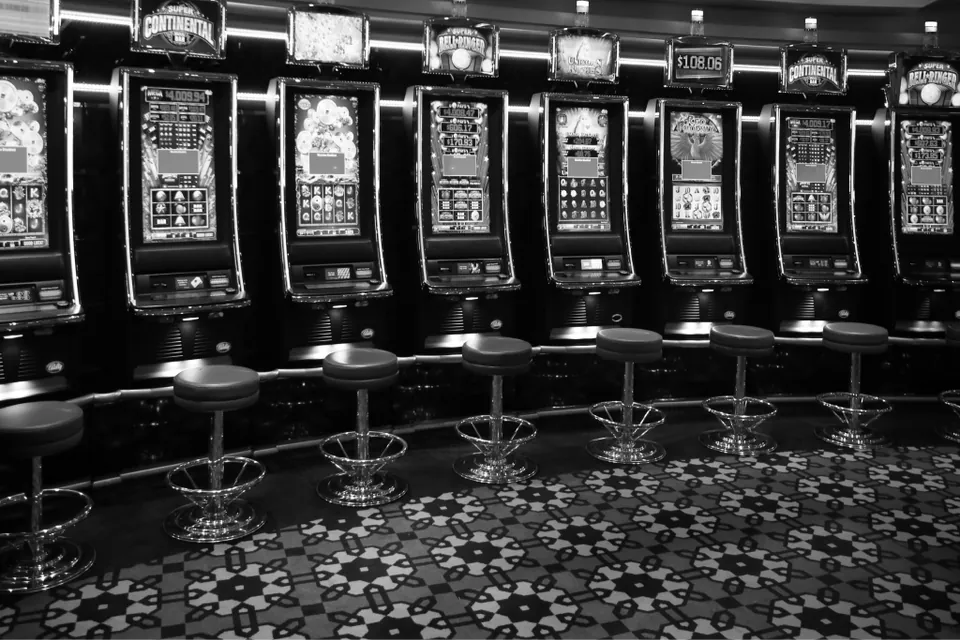 Guests playing slot machines on a casino floor