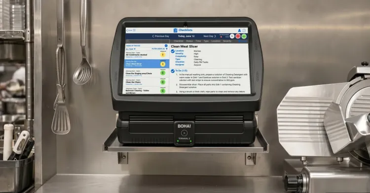 BOHA! Terminal 2 mounted in a commercial kitchen showing a BOHA! Checklist screen for back-of-house workflow access.