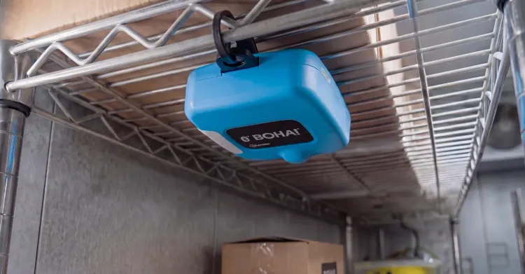 BOHA! Sense wireless temperature and humidity sensor mounted beneath a wire shelf inside a commercial walk-in cooler.