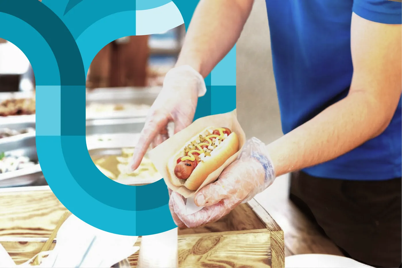 Gloved hands assembling a fresh grab-and-go item behind a convenience-store counter