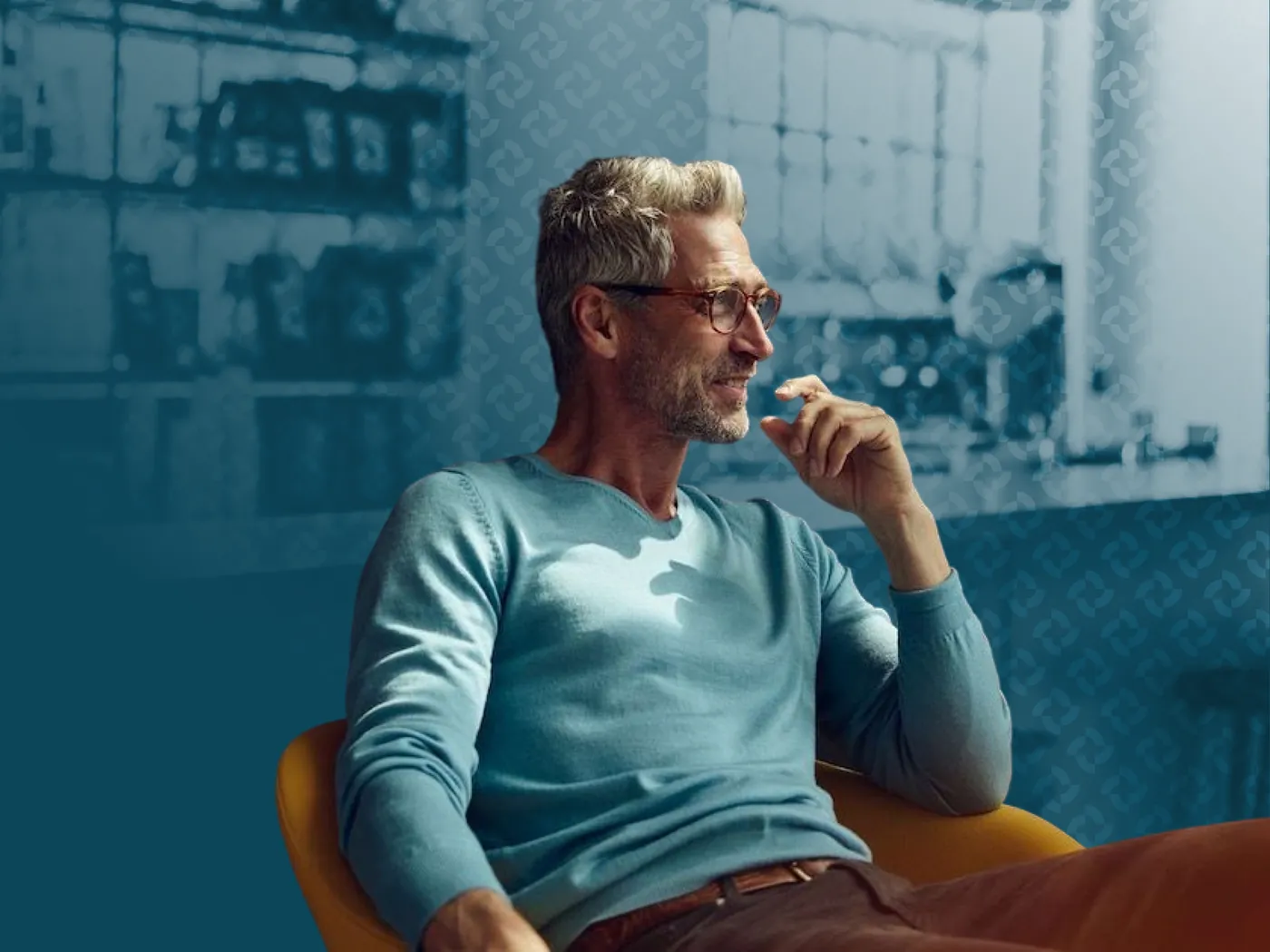 A regional manager seated in a restaurant, in blue duotone