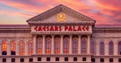 Exterior view of Caesars Palace Las Vegas lit up at night celebrating its 60th anniversary